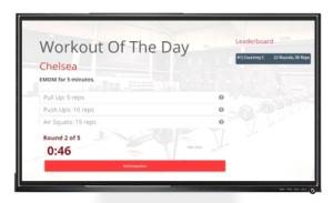 Gym member using wod tracking software to track their workouts and performance