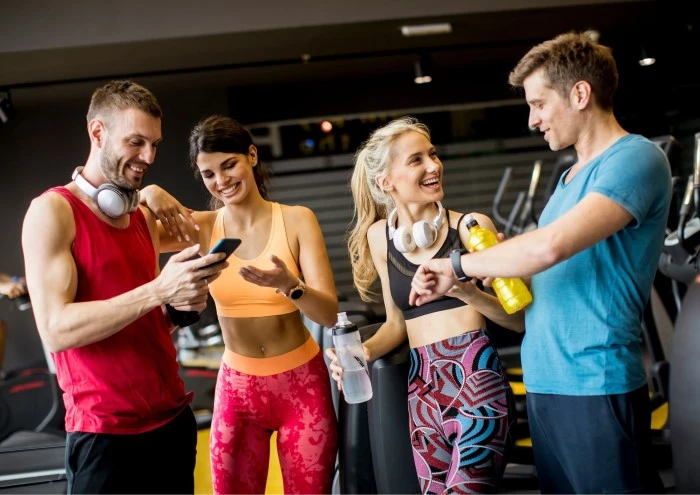 Image of a community of gym members hanging out at a 24/7 gym