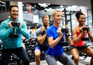 Image of gym members participating in a group fitness class