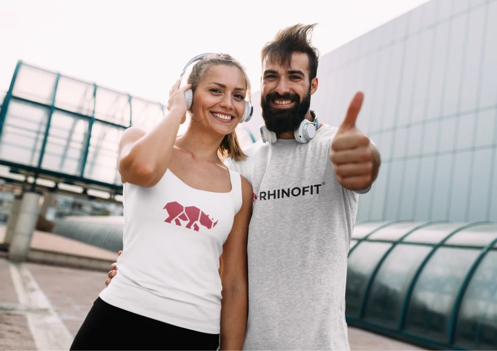 Image of a man and woman wearing RhinoFit gym branding merchandise
