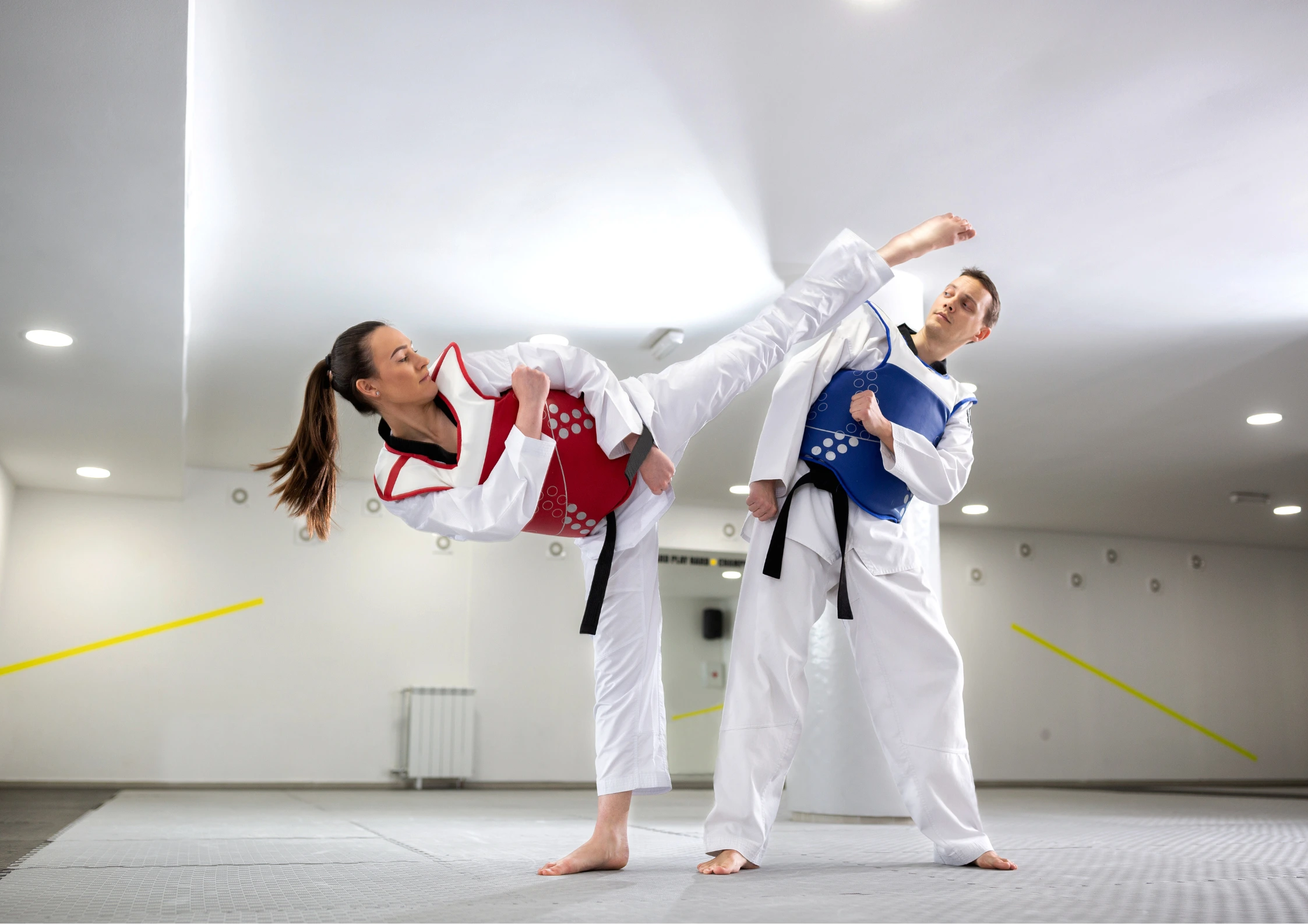 Image of two Taekwondo students competing
