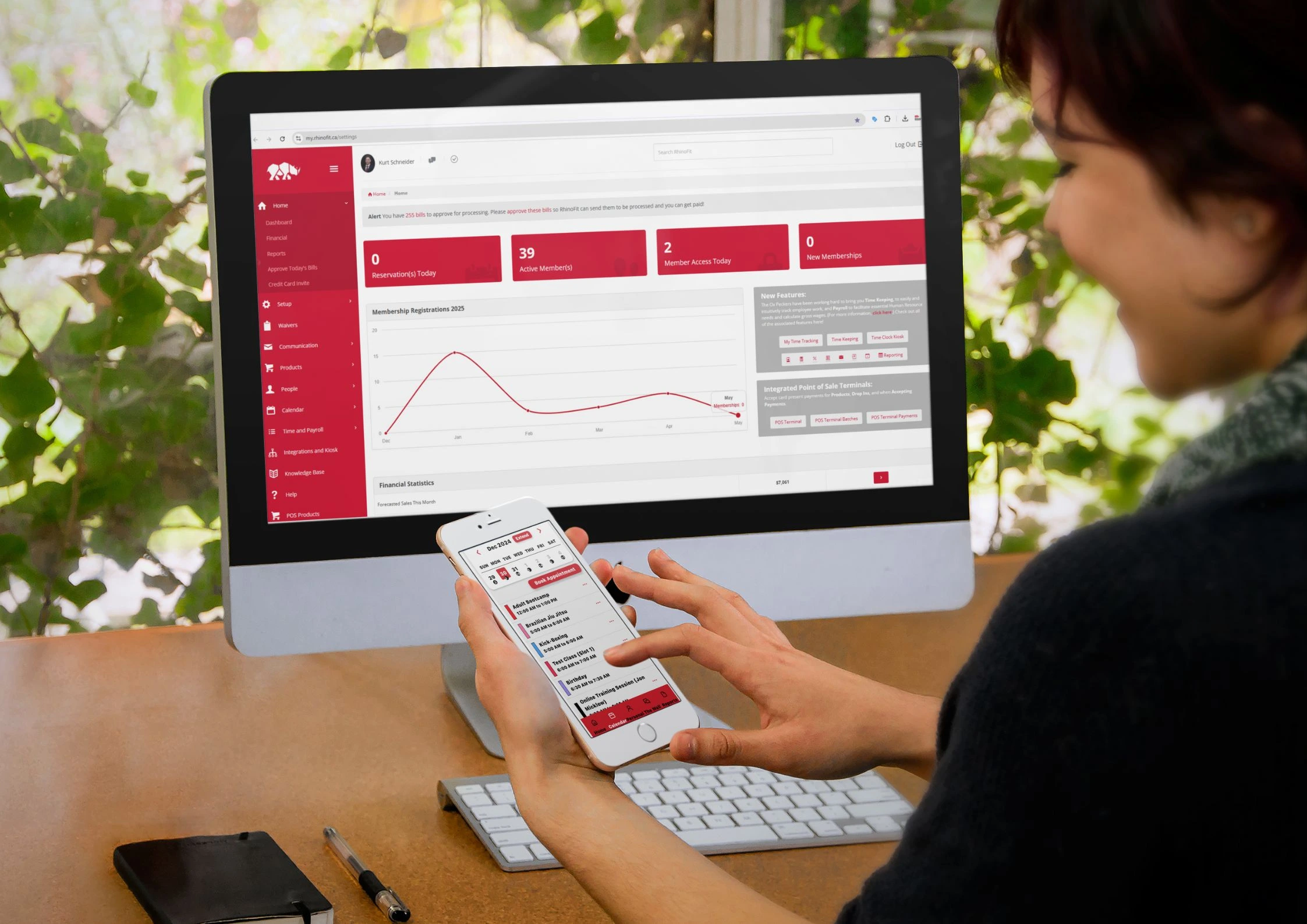Image of a gym owner using RhinoFit top gym management software at the gym