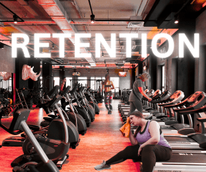 Image of regular members at gym working out showing gym retention