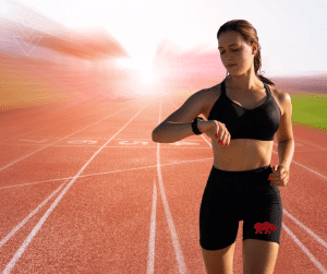 Image of track woman wearing workout tracking device which is gym trends 2025