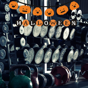 Image of gym halloween decor in front of weights 