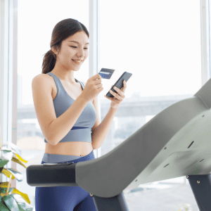 Image of gym women completing online gym billing